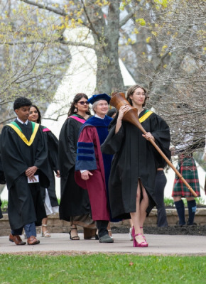 Marshal, Sue Dawson; Macebearer, Shanelle Berthier, Faculty of Science; and Eagle Feather Bearer, Erin Reid, assistant professor, Faculty of Indigenous Knowledge, Education, Research, and Applied Studies, lead graduates in the Faculty of Science into the Chi-Wan Young Sports Centre for their Convocation ceremony on May 16. Marshal, Sue Dawson; Macebearer, Shanelle Berthier, Faculty of Science; and Eagle Feather Bearer, Erin Reid, assistant professor, Faculty of Indigenous Knowledge, Education, Research, and Applied Studies, lead graduates in the Faculty of Science into the Chi-Wan Young Sports Centre for their Convocation ceremony on May 16.