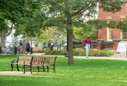 image of student wearing mask in the quadrangle