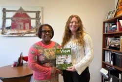 Dr. Marva Sweeney-Nixon, Associate Vice-President Research and Dean of Graduate Studies, and Julie VanLeeuwen, Research Navigator, display a copy of "InView," UPEI's new research magazine. Two women holding magazine