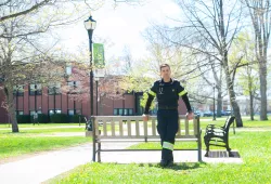 male paramedic standing in the UPEI quad