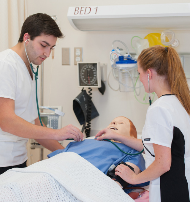 Nursing students practice in lab