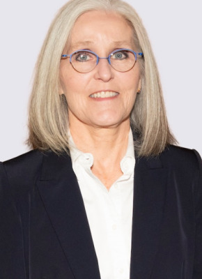 photo of woman wearing glasses against a light background