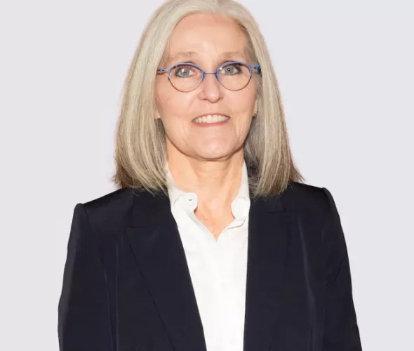 photo of woman wearing glasses against a light background