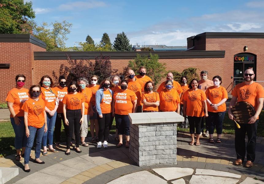 People wearing orange shirts for Orange Shirt Day