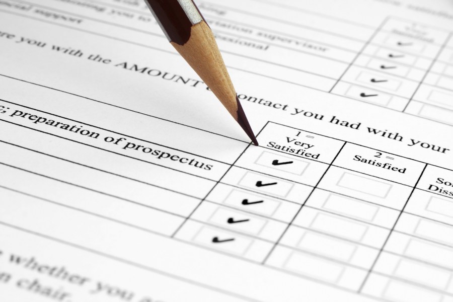 photo of pencil filling in survey form