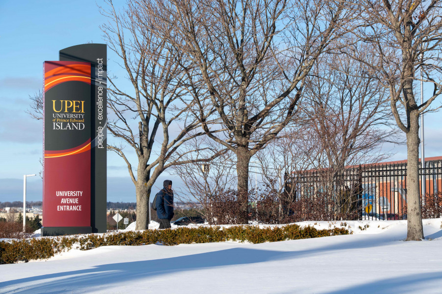 Sign at university entrance in winter