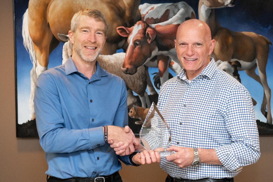 Dr. Larry Hammell, professor of health management, Atlantic Veterinary College, accepts the AVC Atlantic Award of Excellence in Veterinary Medicine and Animal Care Award from Dr. John VanLeeuwen, interim dean, AVC.