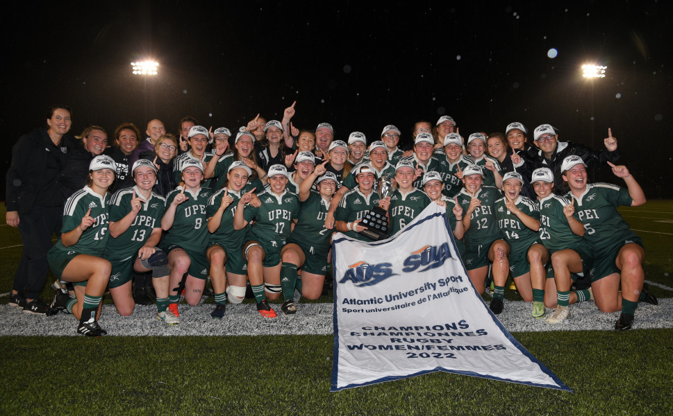 The UPEI Women’s Rugby Panthers display their championship banner after winning the AUS championship in 2022.