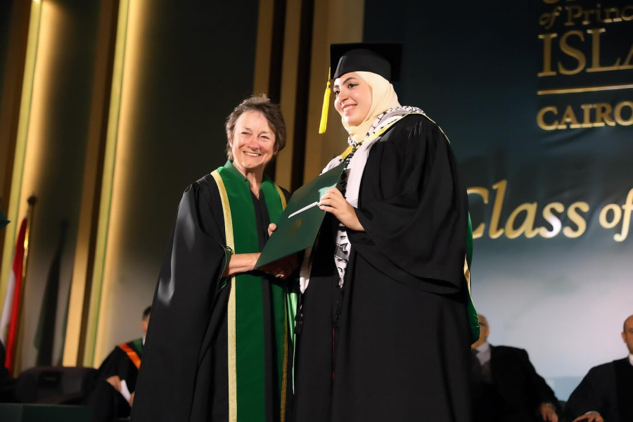 The Honourable Diane Griffin, Chancellor of UPEI pauses for a photo with a UPEI Cairo Campus graduate.