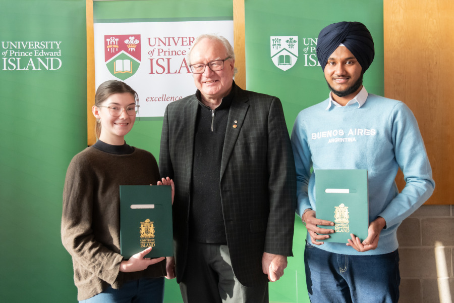 Award winners, Marie-Pier Thibault-Messier, Faculty of Nursing (left) and Rupinder Singh, Faculty of Science (right) with UPEI President Emeritus Wade MacLauchlan (centre).