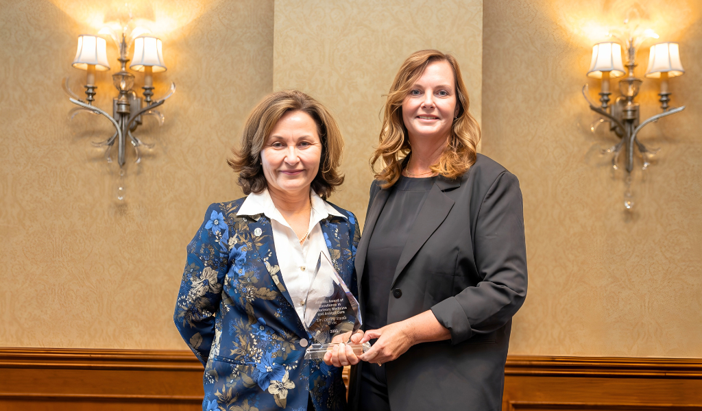 Dr. Dominique Griffon, dean of AVC, presents Dr. Lesley Steele, owner, Steele Veterinary Group (AVC 1993) with the Atlantic Award of Excellence in 2024