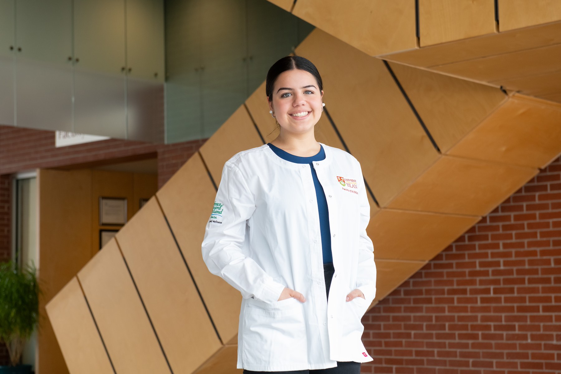 UPEI nursing student Mariana in the Applied Health Sciences building lobby