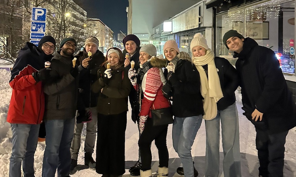 a group of students having ice cream at night in Finland