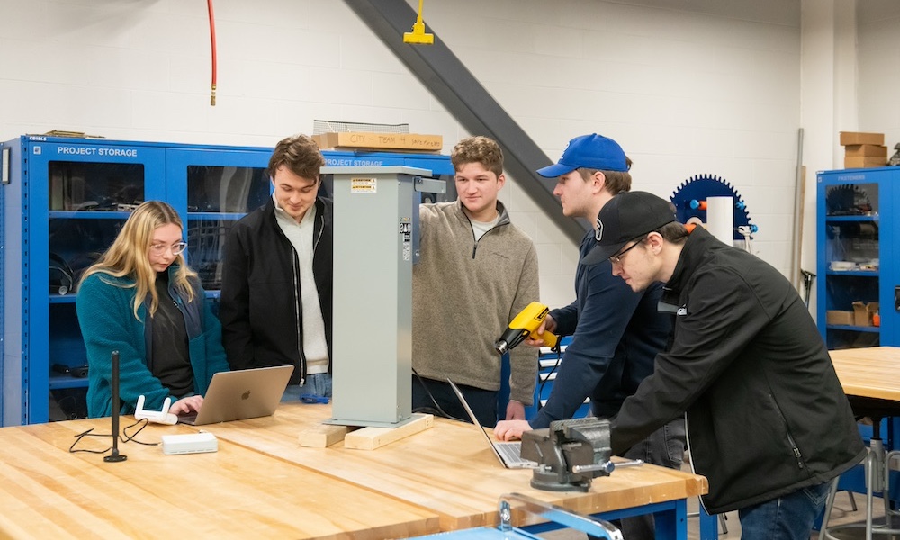 five engineering students working on a project