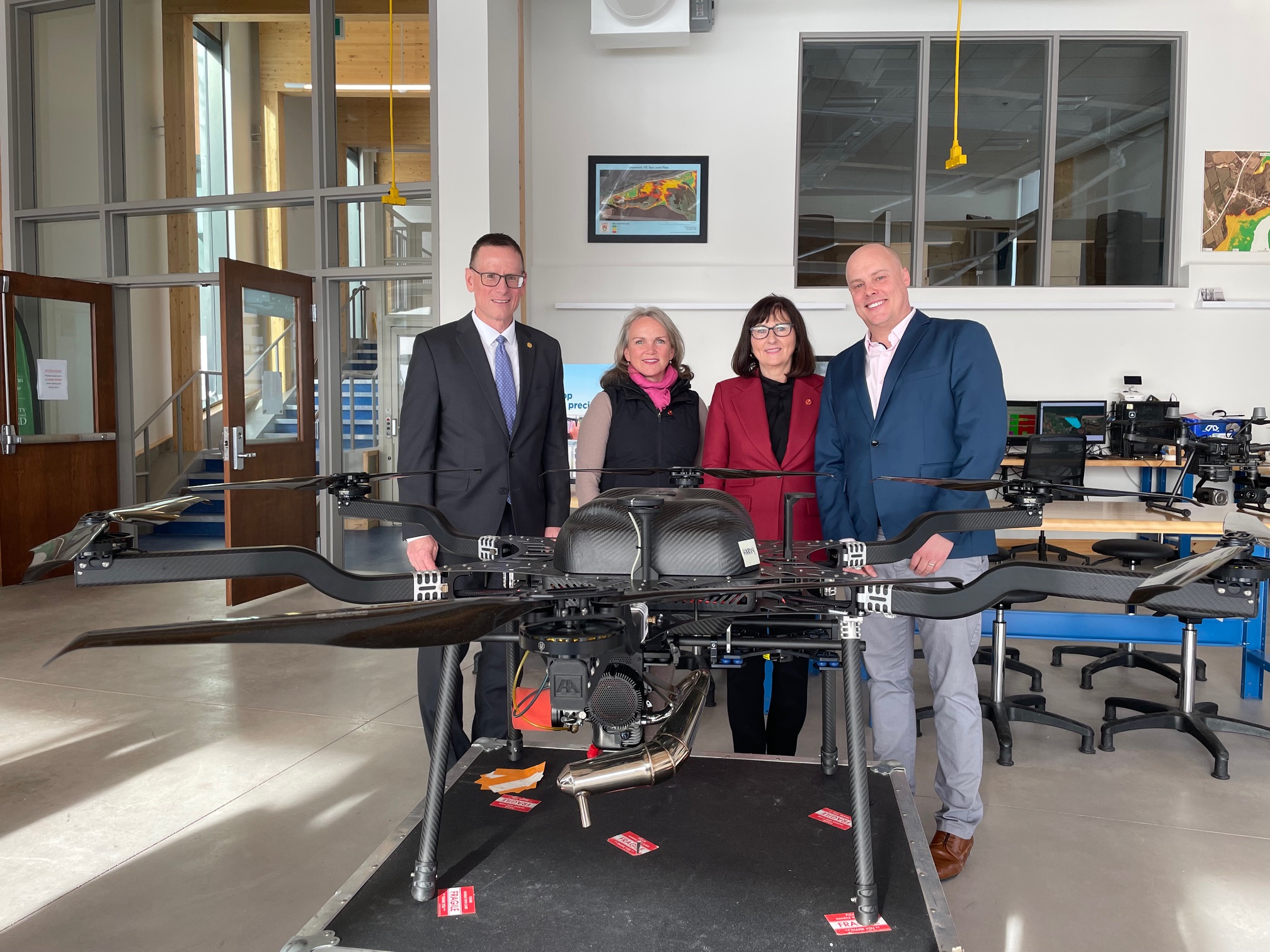 Dr. Greg Naterer, Senators Robinson and MacAdam, and Ross Dwyer at the UPEI Canadian Centre for Climate Change and Adaptation