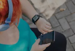 photo of woman recording her exercise on her mobile phone app