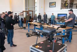 Luke Meloche, Remotely Piloted Aircraft System Pilot and Research Assistant at the UPEI Climate Lab provides information on lab’s fleet of drones to some of the Open House attendees