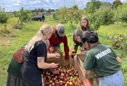 As part of an “Afternoon of Service” in June 2022, UPEI student volunteers participated in various activities with residents of The Mount Continuing Care Community, including helping with the apple orchards.