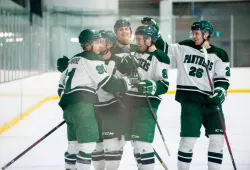 The UPEI Men's Hockey Panthers celebrate a goal in Saturday's (November 26) win against the Dalhousie Tigers.