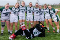 Photo of women's rugby team with mascot Pride the Panther