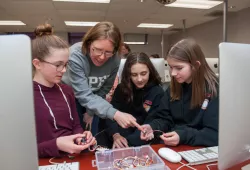 Megan Glover, UPEI physics and engineering lab technician guides a group of Girls Get WISE participants