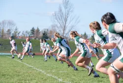 The UPEI Women's Rugby Panthers line up for a kickoff against the St. Francis Xavier X-Women during the 2022 AUS semifinals.