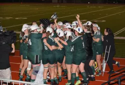 The UPEI Women’s Rugby Panthers celebrate after winning the AUS championship in 2022.