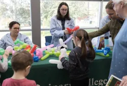 Students make balloon animals at the AVC Open House