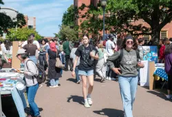 photo of students walking on a crowded campus walkway