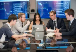 students meeting in a boardroom 