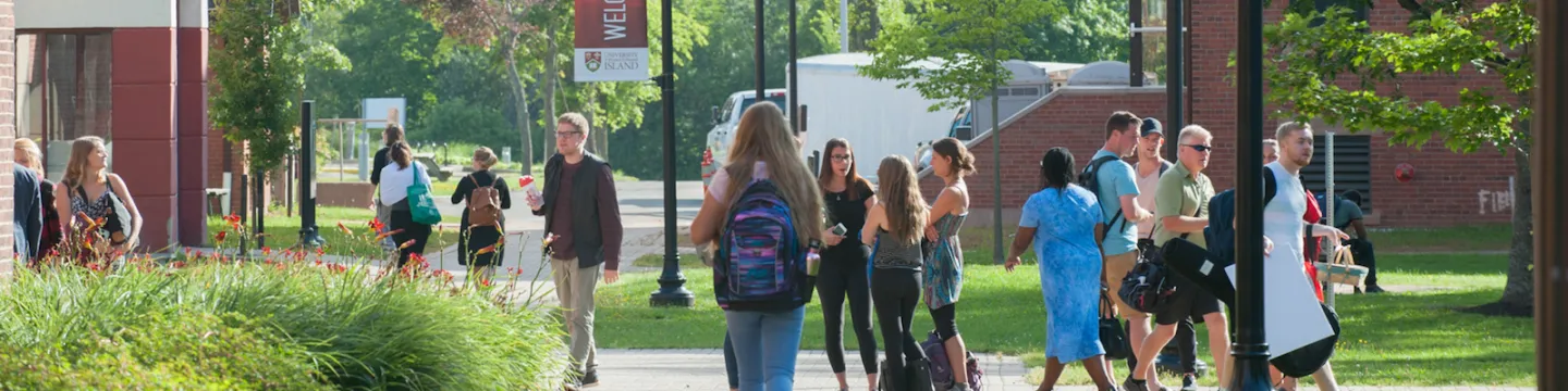 students in the quad in front of steel building 