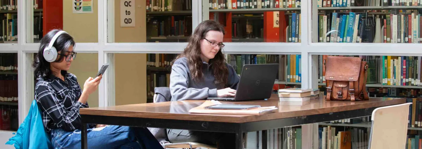 two students studying at a table