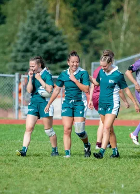 Three UPEI rugby athletes on the field 