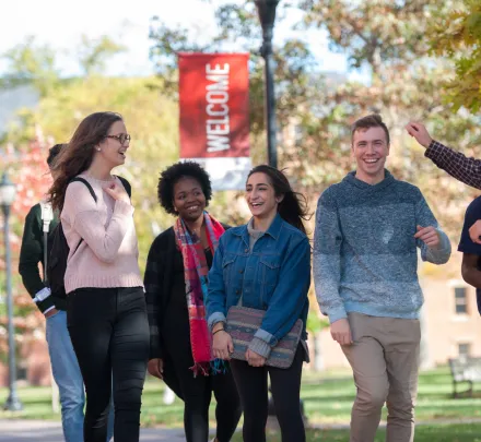 students walk through the UPEI quad