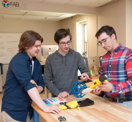 engineering students testing 3d printer