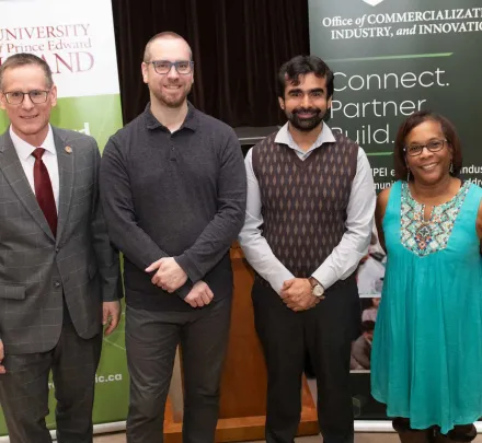 four researchers at an event