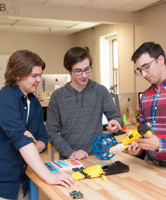 engineering students testing 3d printer