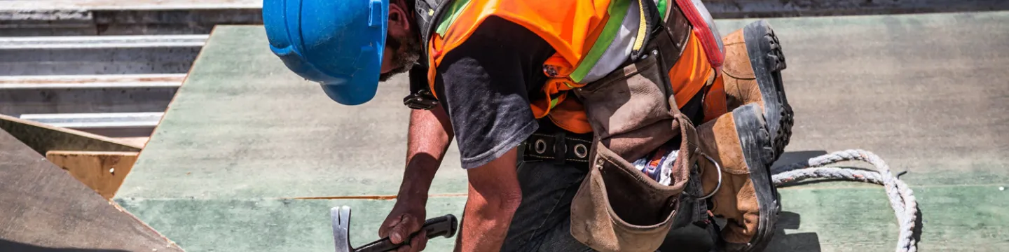 Construction Worker hammering a nail