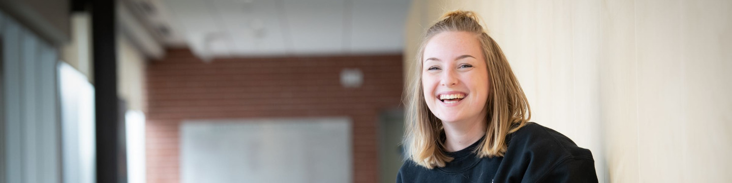 a UPEI education student working on a laptop computer