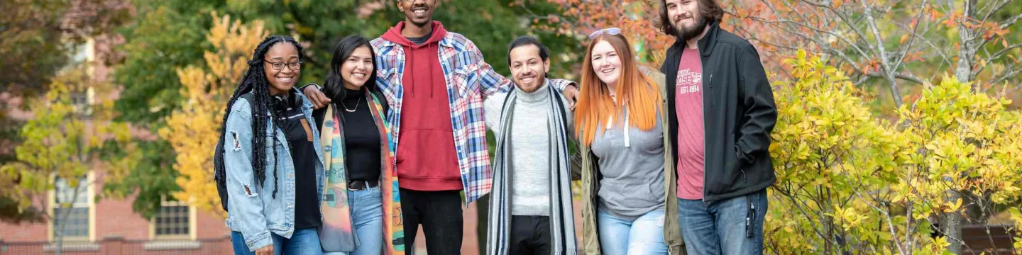 six UPEi students standing in the quadrangle in fall