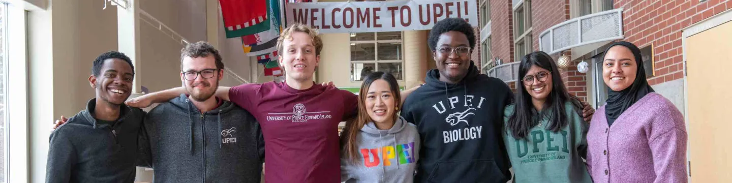 seven students in the W.A. Murphy Student Centre hallway