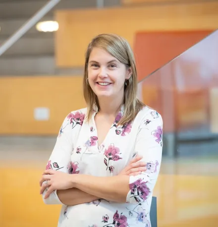 a smiling UPEI professor in a flowered shirt