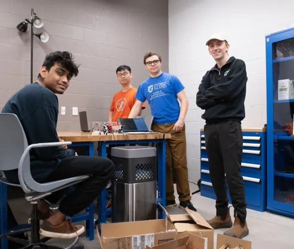 four engineering students and their fourth-year project