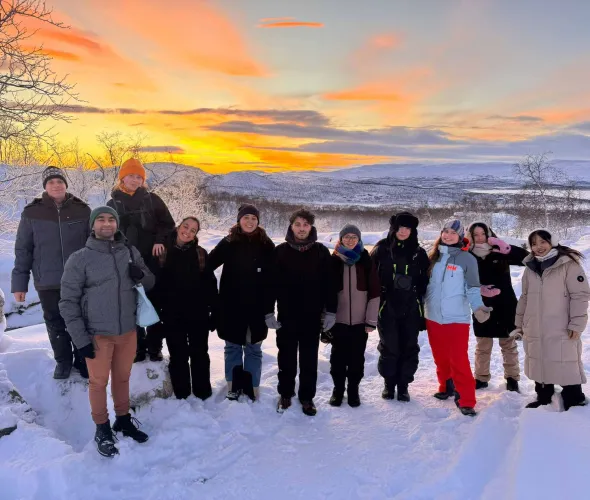 a group of students in Finland at sunset